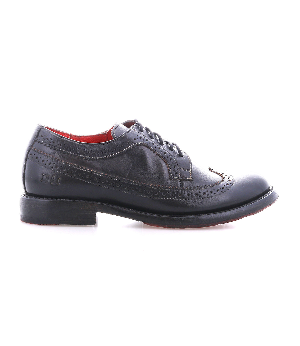 The Bed Stu Lita K II black leather wingtip shoes feature decorative perforations, a lace-up closure, and a low heel, shown from the side on a white background.