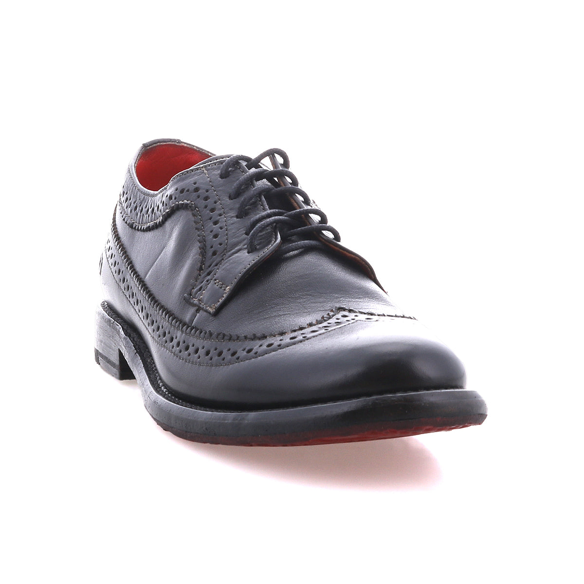 The Bed Stu Lita K II is a single black leather wingtip shoe with decorative perforations, red interior lining, and black laces, shown on a white background.