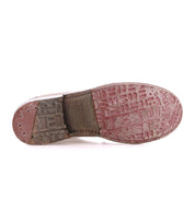 The underside of a worn Bed Stu Lita K II derby shoe shows visible textured patterns, branding, and scuff marks on the sole.