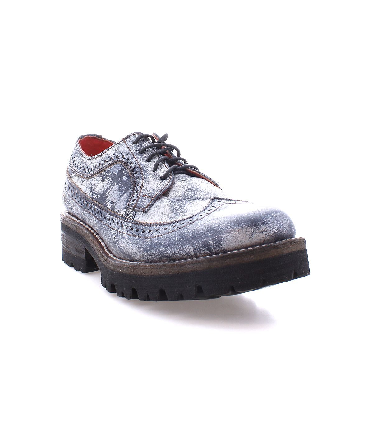 The Lita K III by Bed Stu, a gray leather Oxford shoe featuring a textured finish and thick black sole, is depicted from a low angle on a white background, embodying retro chic with a nod to 90’s fashion.