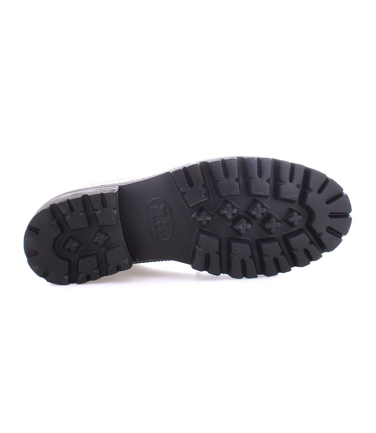 The image highlights the bottom view of the Lita K III black boot sole by Bed Stu, featuring a textured, rugged tread pattern that exudes a retro chic vibe.