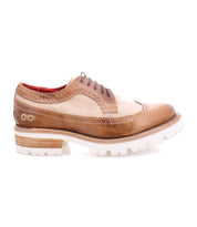 A retro chic men's Lita K III wingtip oxford shoe in tan and beige, perfect for the fall wardrobe by Bed Stu.