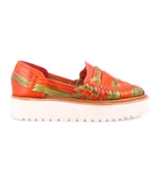 The Lizzie by Bed Stu is a hand-woven leather shoe in striking red and green, featuring a modern thick white XL EXTRALIGHT® outsole.