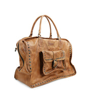 The Loaf by Bed Stu is a brown leather handbag featuring studded details, a front pocket buckle, dual handles, and quality construction, ideal as a classy carry-on.