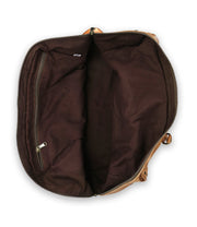 The Bed Stu Loaf is an open brown leather carry-on bag with a dark fabric interior and a handy zippered pocket, crafted from quality leather.
