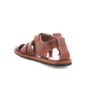 The Bed Stu Lone sandal features distressed brown leather straps, an open toe and heel, a flat sole, and an antique brass buckle. Shown from the back and side.