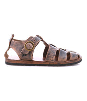 The Bed Stu Lone sandal features distressed brown leather straps, an antique brass buckle closure, a flat sole, and a left side profile view.