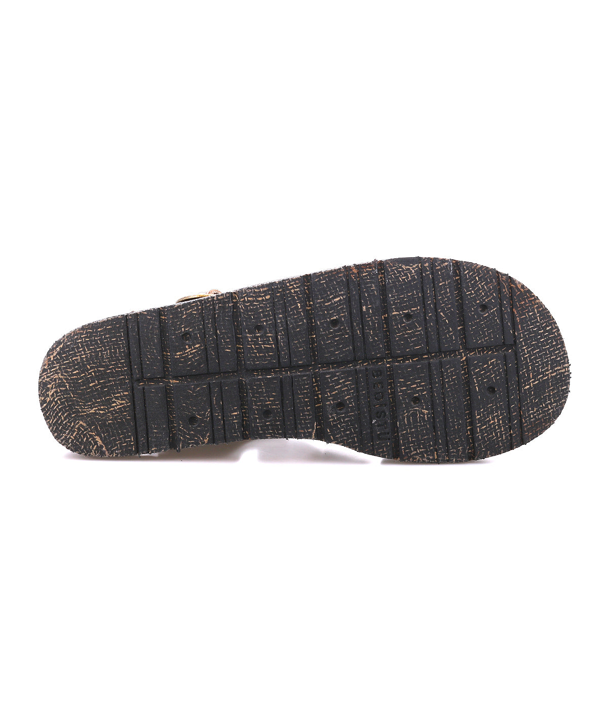 The image shows the worn sole of the Bed Stu Lone black strappy sandal, featuring visible tread patterns and signs of use.