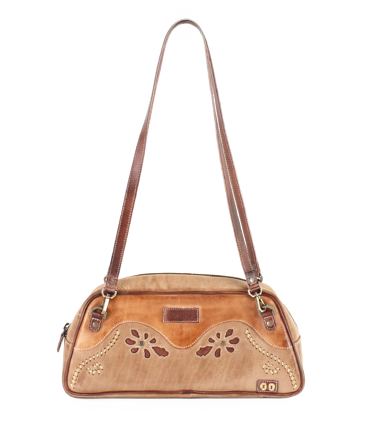 Lorien compact tan leather shoulder bag featuring two straps and floral motif cutout details.
