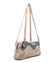 Bed|Stü Lorien tan and green color-blocked leather crossbody bag with floral motif cutouts and long shoulder straps.