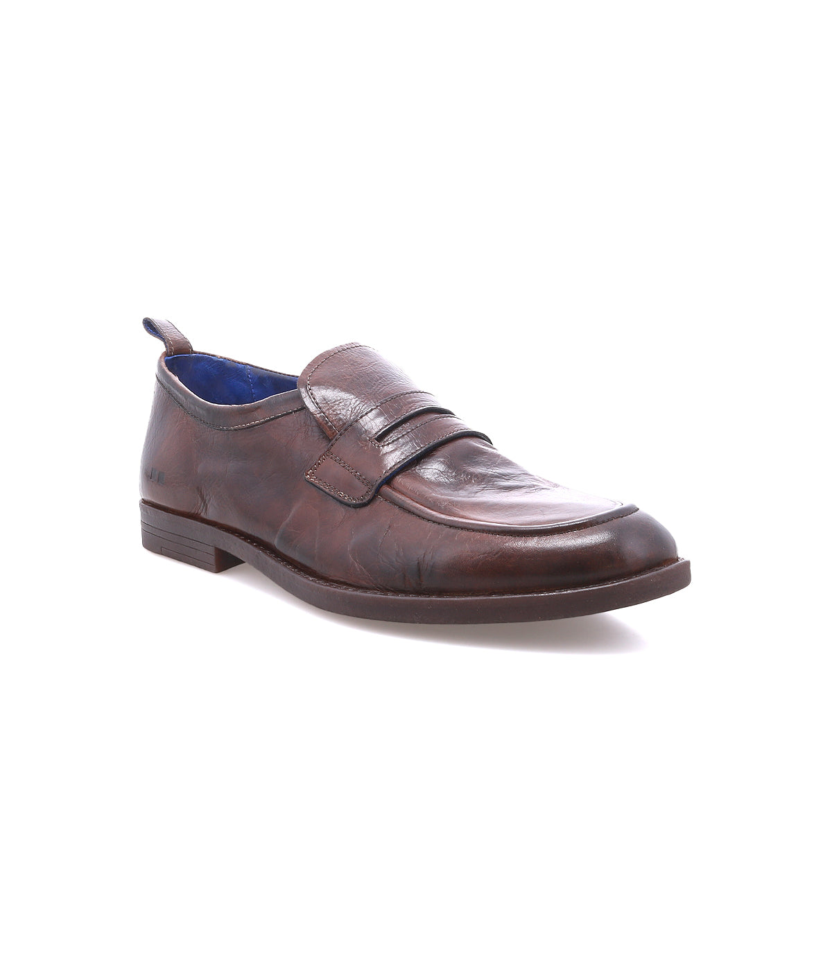 The Bed|Stü Lumaro is a brown penny loafer crafted from distressed leather, featuring classic penny strap detailing, a low heel, and a distinctive blue inner lining for a touch of relaxed elegance, displayed on a white background.