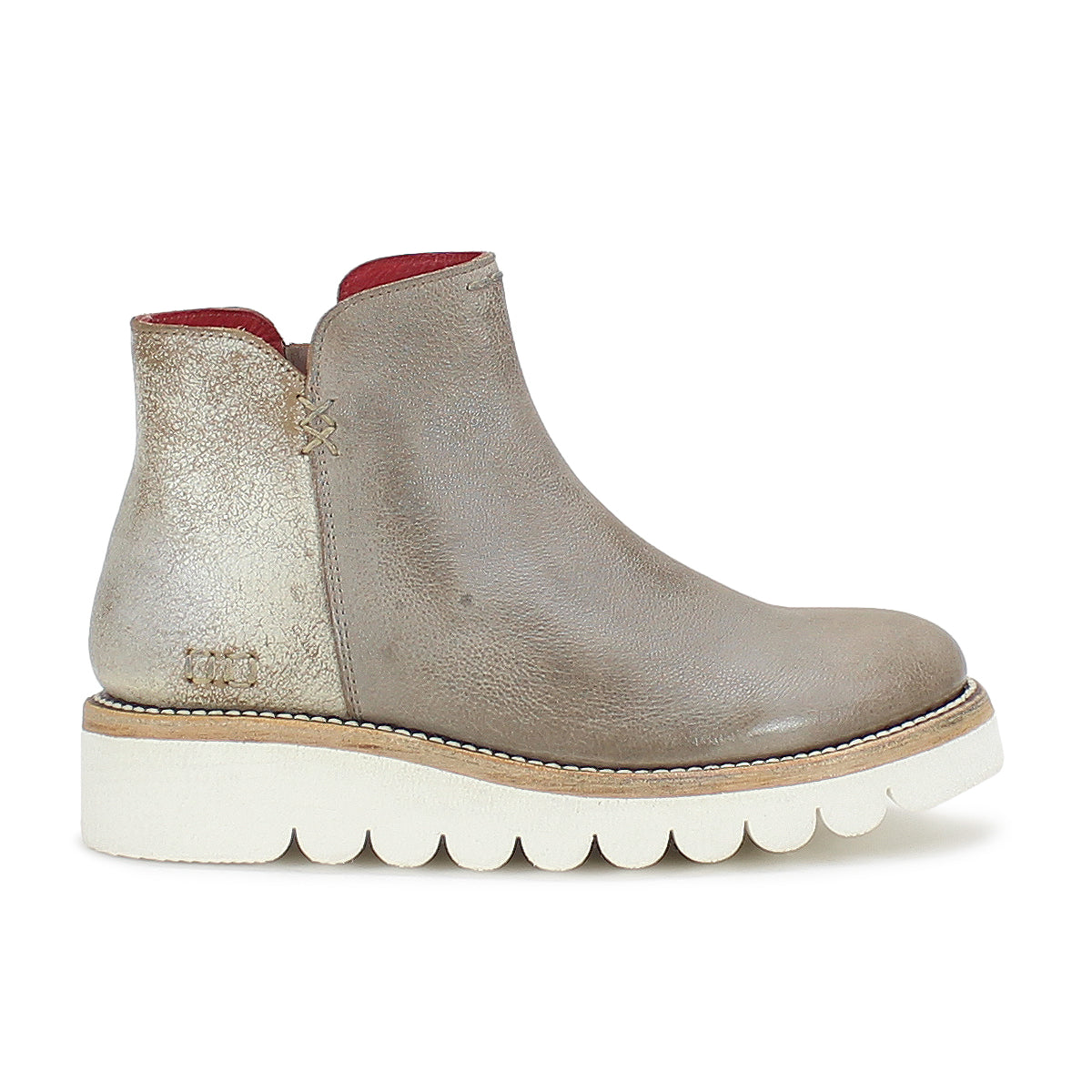 A versatile women's Lydyi ankle boot with a red sole by Bed Stu.