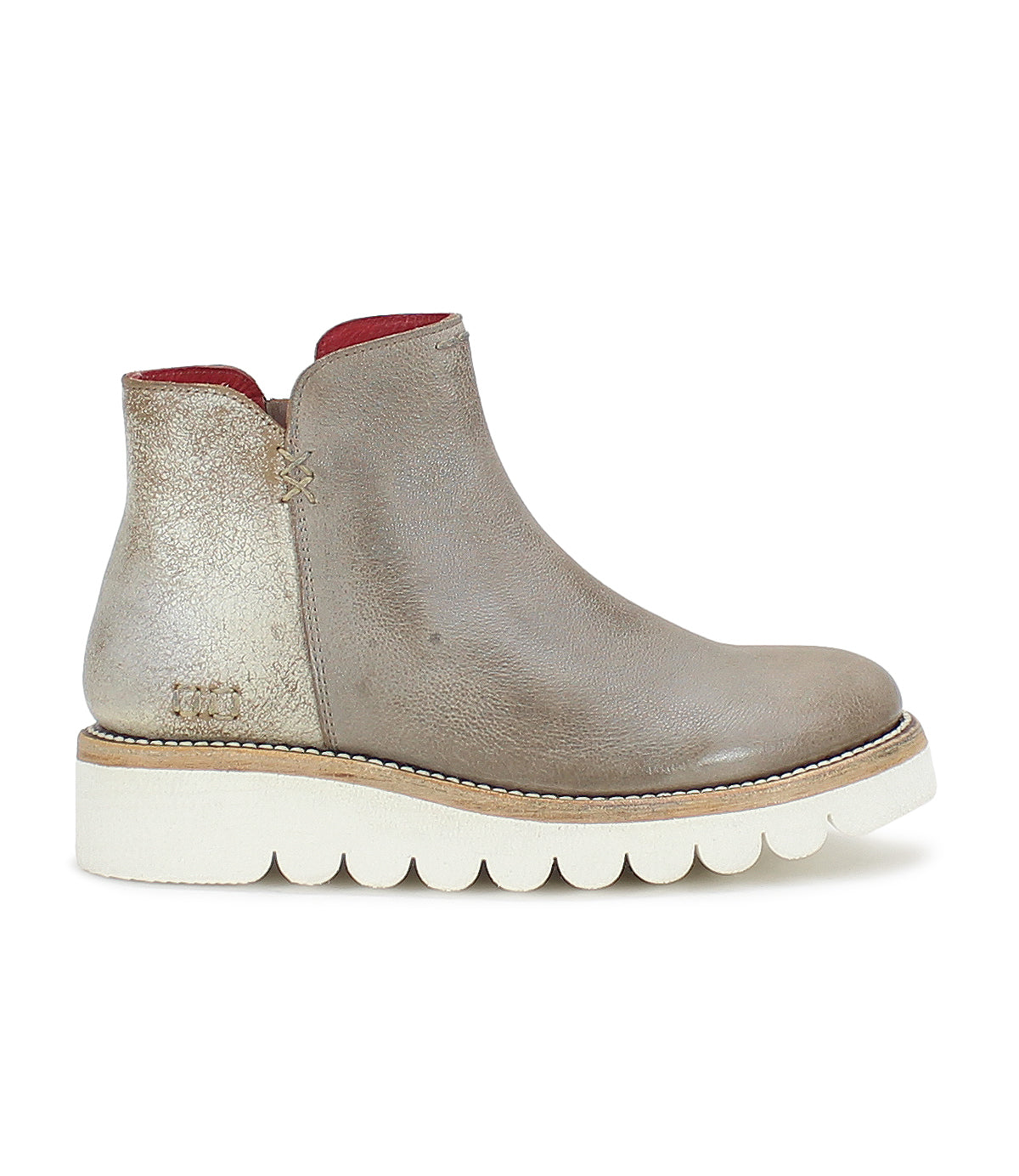 A versatile women's Lydyi ankle boot with a red sole by Bed Stu.
