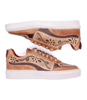 Bed|Stü Lynox tan leather sneakers with a hand-stitched floral motif and thick white soles.