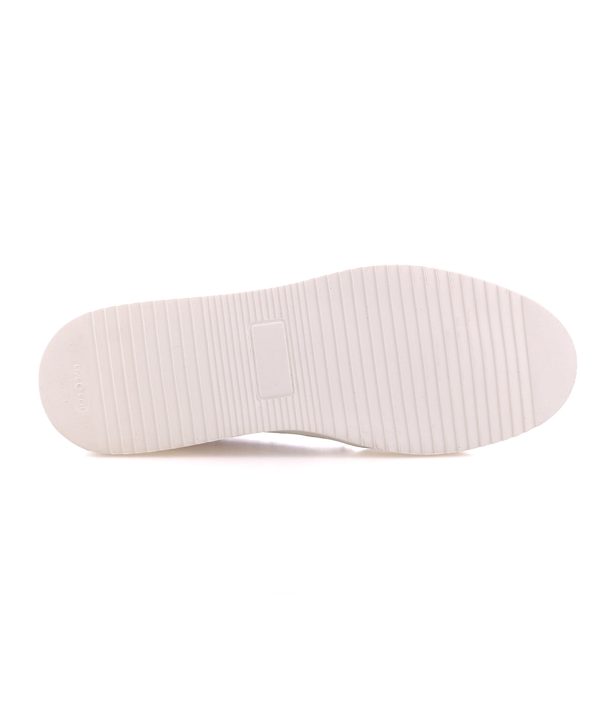 White rubber sole of a Lynox sneaker with a horizontal ribbed tread pattern.