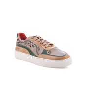 Bed|Stü Lynox low-top sneaker in tan, green, and grey leather with floral motif cut-out detailing, hand-stitched vine details, thick laces, and a white rubber sole.