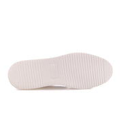 Off-white rubber sole of a Lynox sneaker featuring a textured, ridged tread pattern.