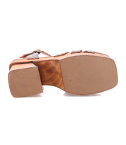 Bottom view of the Bed Stu Lyxon sandal, an open-toe wooden platform with a brown sole and heel, stud accents, and leather t-strap upper.
