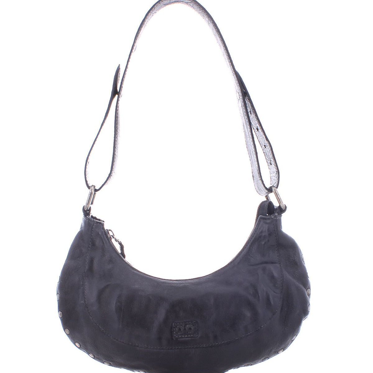 Introducing the Madre by Bed Stu—a black leather shoulder bag featuring a curved design and metallic rivets around the edges. This edgy piece infuses any outfit with a rock ‘n’ roll vibe.