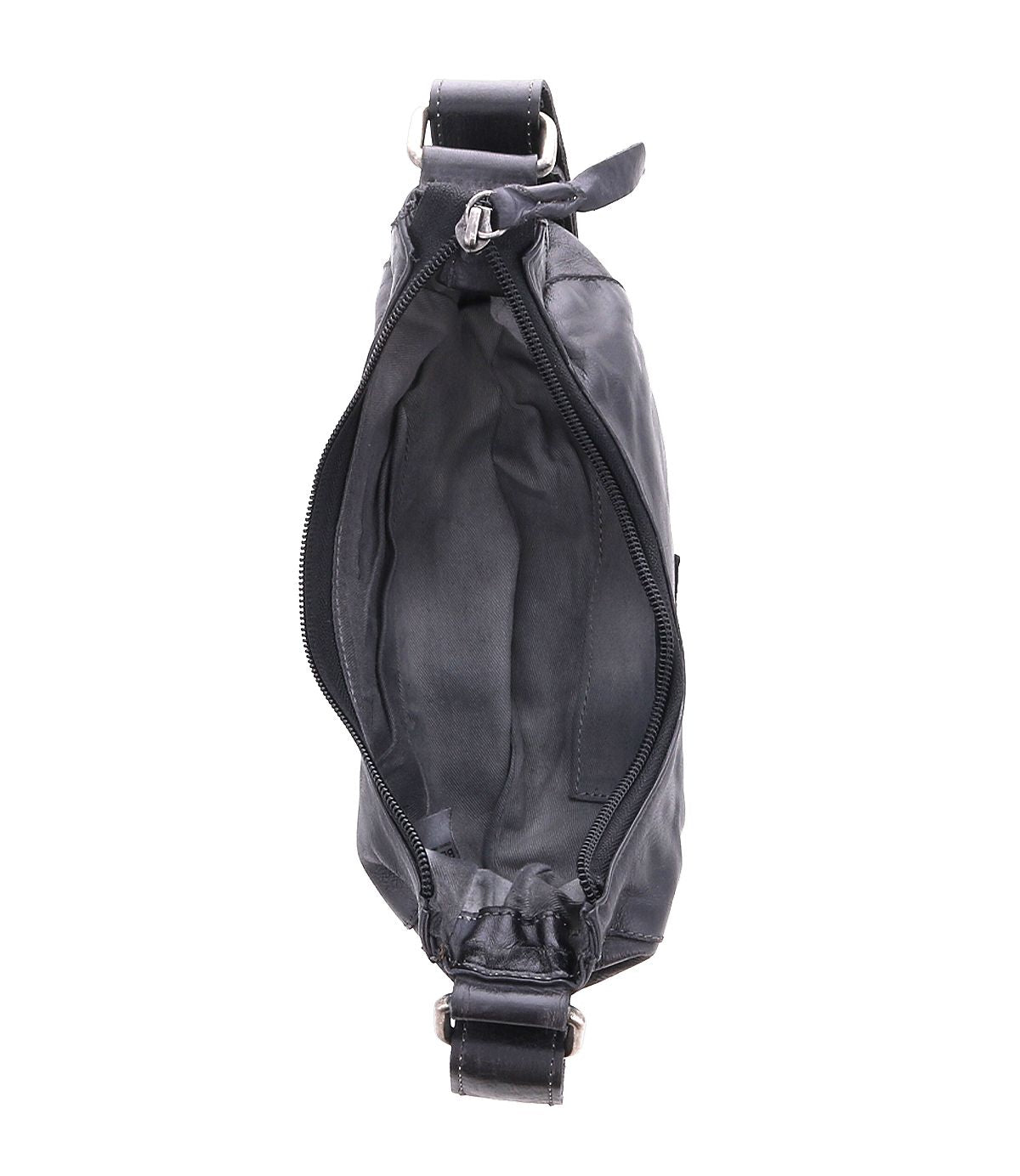 Top view of an open Madre by Bed Stu, a black leather crossbody bag that makes a statement with its edgy shoulder strap. It features a visible zipper and reveals its empty interior.