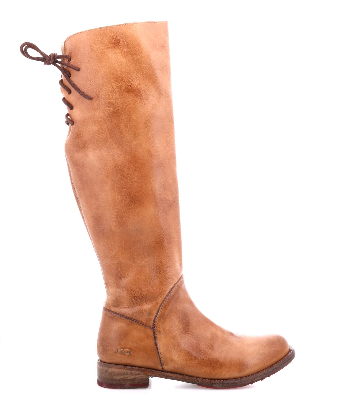 The Manchester boot by Bed Stu is a women’s tall boot in brown leather with a low wooden heel, rounded toe, and back lace-up detail, shown in side profile on a white background.