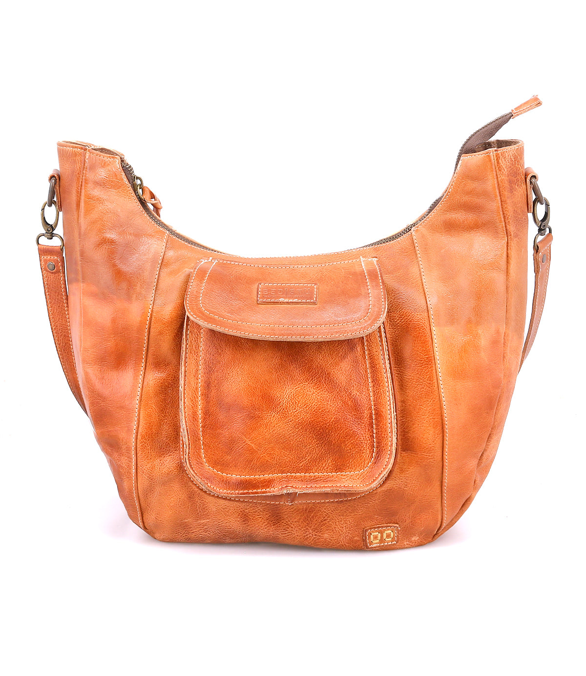 The Manitoba by Bed Stu is a light brown leather shoulder bag featuring a curved top, front flap pocket, and a short adjustable strap—ideal for everyday use.