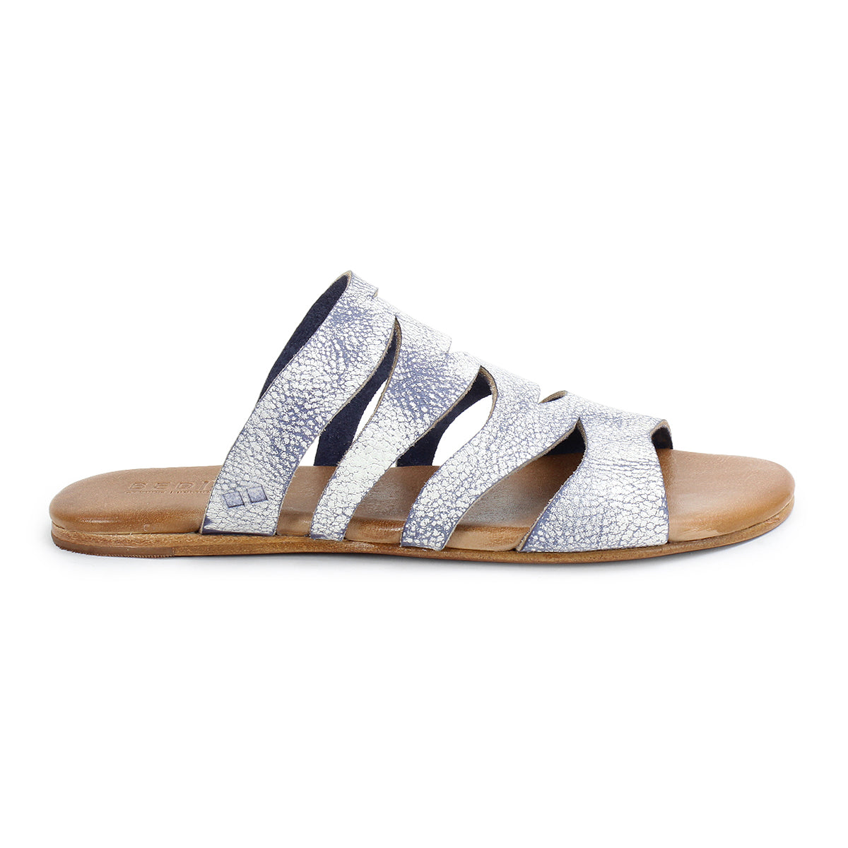 From the side, the Bed Stu Margin showcases a silver strappy slide sandal with a textured leather upper and a brown flat sole, crafted for all-day comfort.