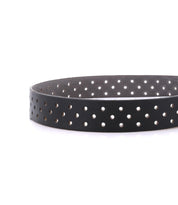 The Bed Stu Mccoy is a black vegetable-tanned leather belt featuring evenly spaced circular holes along its length, combining modern style with timeless design, shown on a white background.