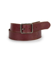 The Bed Stu Meander belt, crafted from brown distressed leather and featuring an antique metal buckle, is shown rolled against a white background.