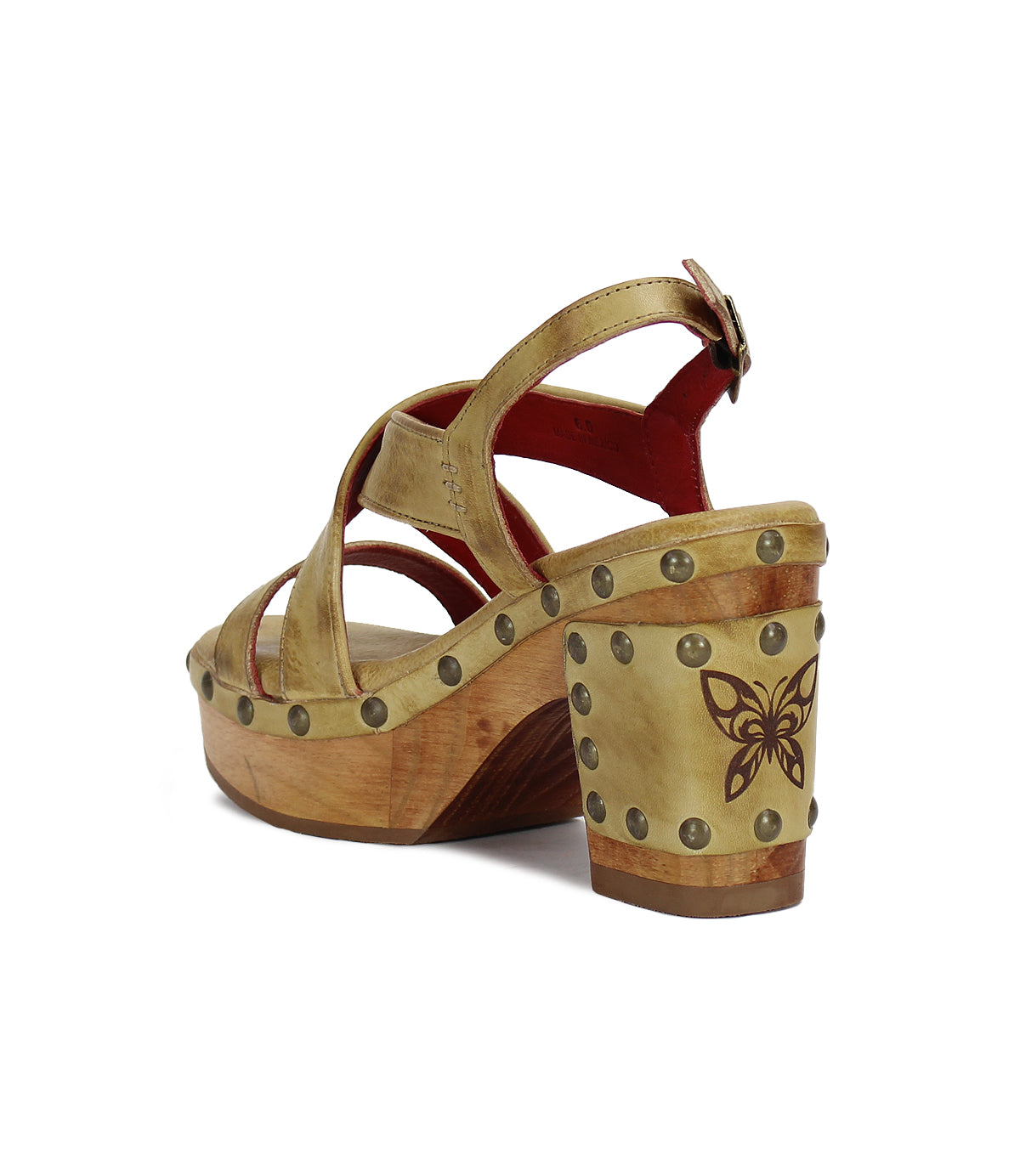 A pair of Bed Stu Mediation sandals with studs and a wooden base.