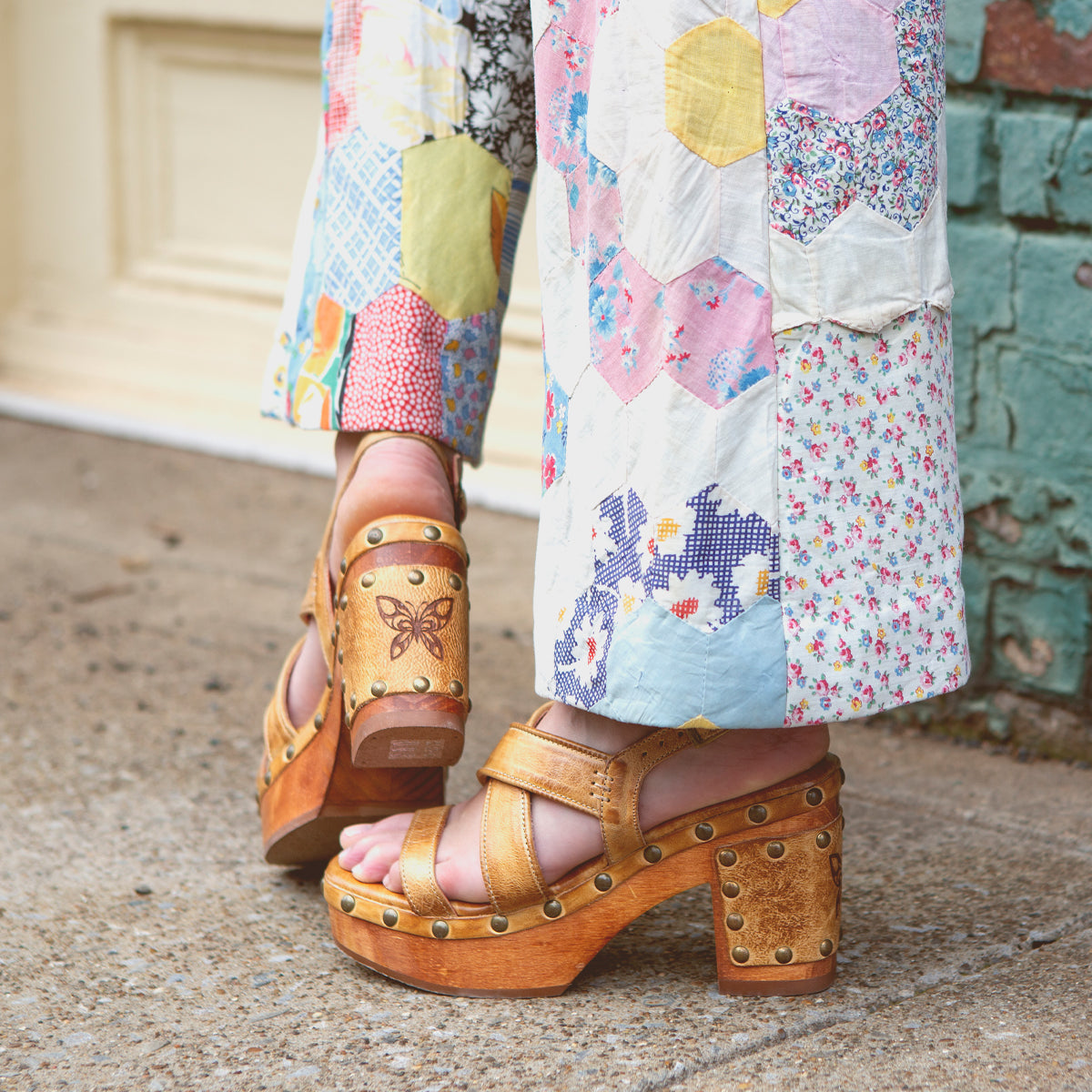 A person in Bed Stu comfortable pants engaged in Mediation, with the added convenience of wearing sandals.