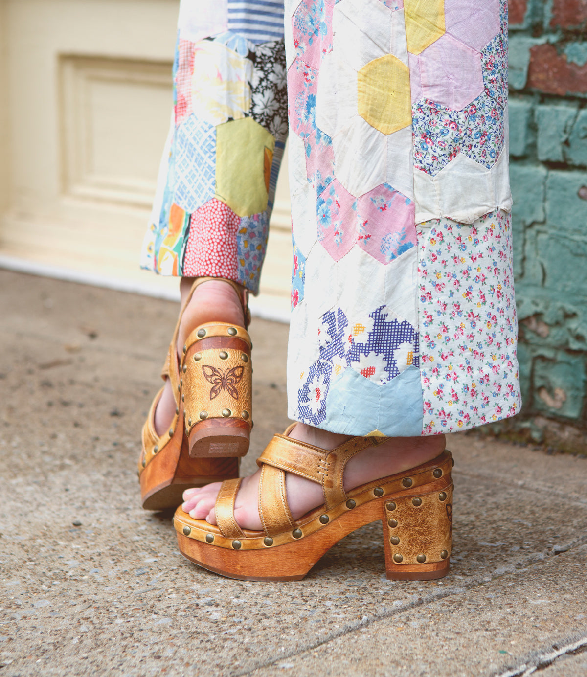 A person in Bed Stu comfortable pants engaged in Mediation, with the added convenience of wearing sandals.