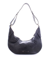 The Megara saddle bag by Bed Stu showcases a crescent shape and adjustable strap, enhanced with exquisite leather details.