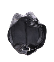 Top view of an open black Megara leather bag by Bed Stu, featuring intricate leather details and metal stud accents, revealing an empty interior. This stylish design makes it the perfect everyday companion.