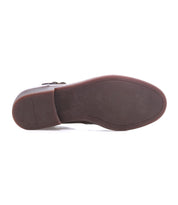 The image shows the bottom view of the Bed Stu Michelangelo Chelsea boot, featuring a brown flat sole with slight heel, minimal tread, visible edge stitching, and a durable rubber outsole for lasting wear.