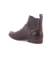 The Bed Stu Michelangelo is a brown leather Chelsea boot featuring elastic side panels, a pull tab, and a durable rubber outsole, shown from a rear side angle on a white background.