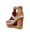 A women's Bed Stu Millennial T-strap wedge sandal with studs and a wooden platform, featuring a back zip closure.