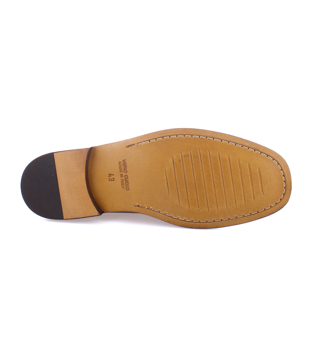 The image showcases the sole of a men's shoe with a tan leather finish, black heel, visible stitching, and text indicating 'Vero Cuoio' and size '43'. This classic loafer is the Moat by Bed Stu, handcrafted in Italy from high quality leather.