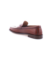 A single Moat loafer made from high quality leather, with a low heel, viewed from the rear side against a white background. Handcrafted in Italy by Bed Stu.