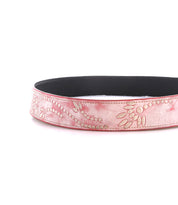 The Mohawk by Bed Stu is a pink and black women's distressed leather belt featuring elegant embossed floral patterns.