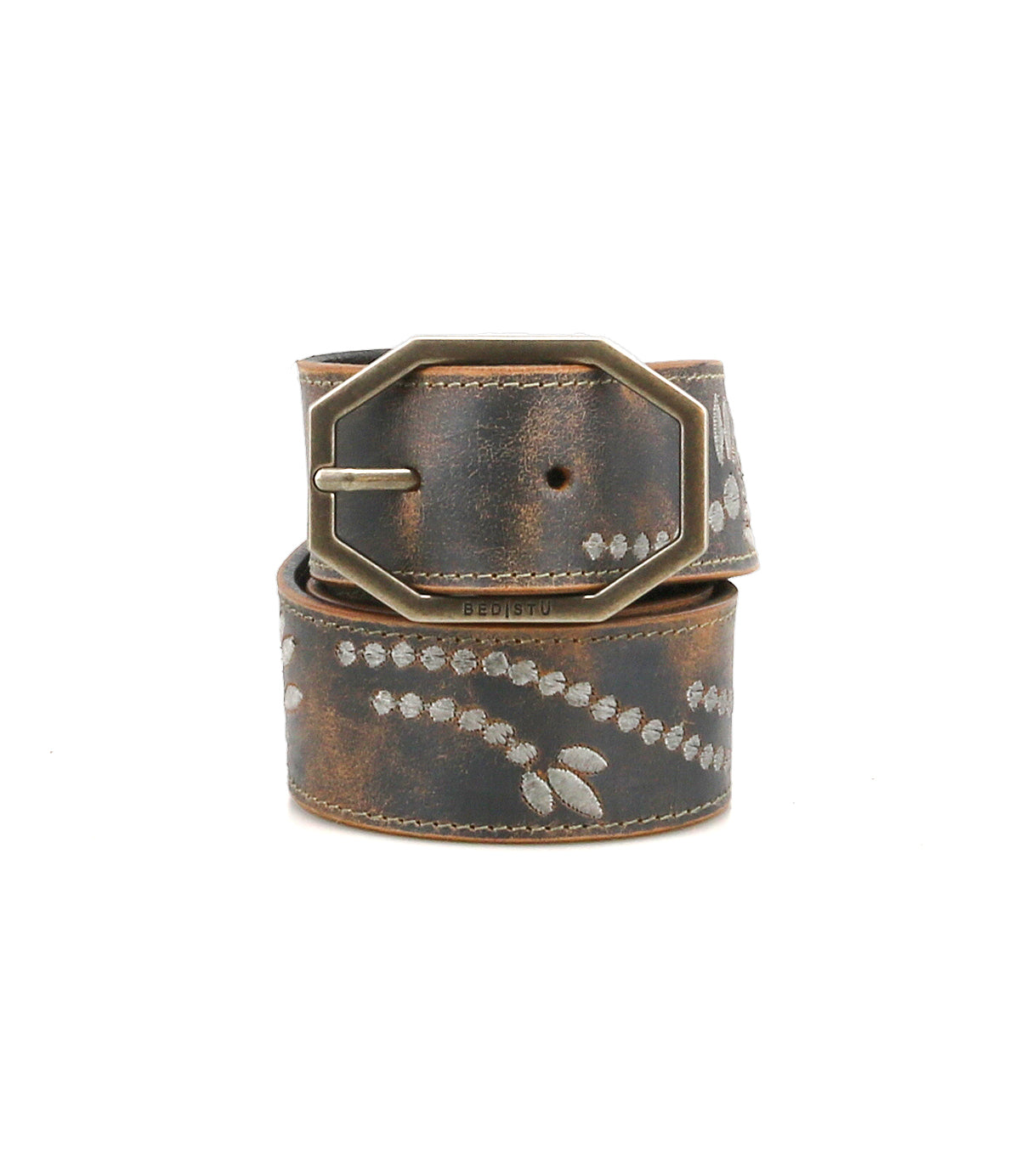 The Bed Stu Mohawk women’s belt features distressed leather, light leaf patterns, a weathered finish, and a large antique-style rectangular buckle for vintage-inspired charm.
