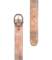 The Bed Stu Mohawk is a distressed leather belt in worn tan, featuring a metal buckle, visible rivets, and faded markings near the pointed end for a vintage look.