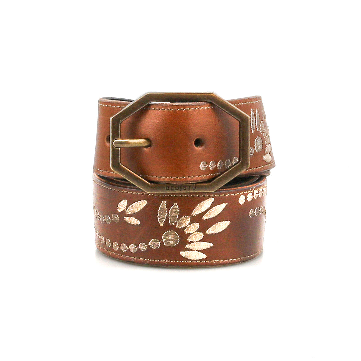 The Bed Stu Mohawk is a distressed brown leather belt with a gold embroidered leaf and dot pattern and a large octagonal brass buckle, shown against a white background.