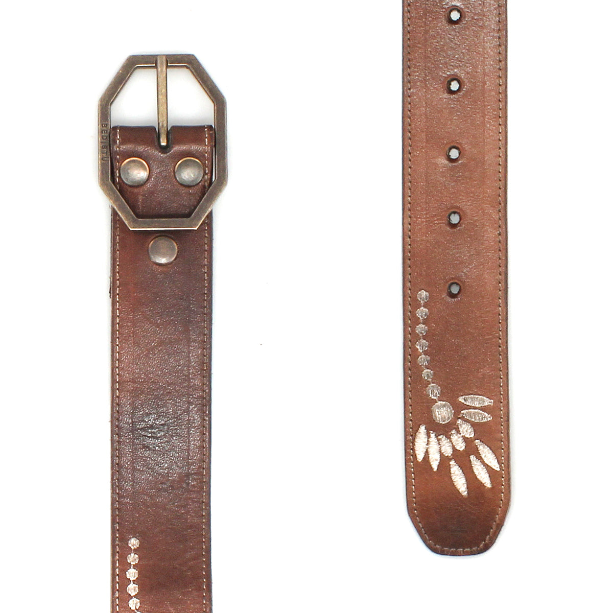 The Bed Stu Mohawk is a brown distressed leather belt with a silver hexagonal buckle and engraved leaf designs, making it a perfect women's floral belt to add elegance to any outfit.
