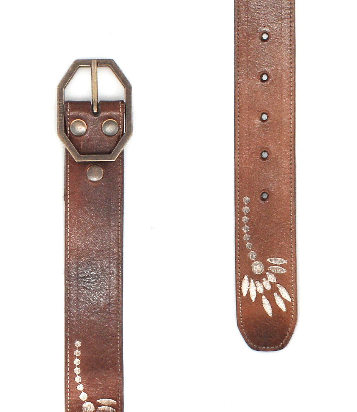 The Bed Stu Mohawk is a brown distressed leather belt with a silver hexagonal buckle and engraved leaf designs, making it a perfect women's floral belt to add elegance to any outfit.