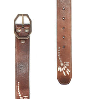 The Bed Stu Mohawk is a brown distressed leather belt with a silver hexagonal buckle and engraved leaf designs, making it a perfect women's floral belt to add elegance to any outfit.