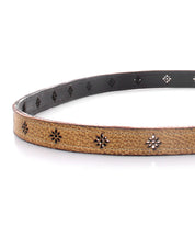 An accessory that perfectly combines style and durability, the Monae II belt by Bed Stu is made from high-quality leather in a timeless tan shade. The standout feature of this belt is the placement of black stars that add
