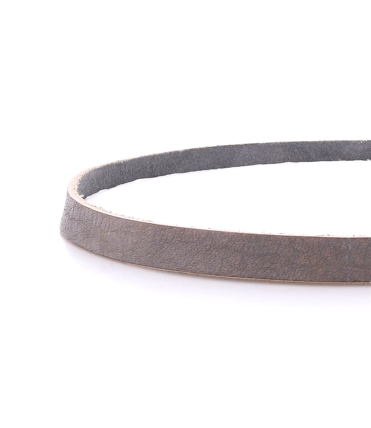 A close-up of the Bed Stu Monae brown leather belt with a suede inner lining, coiled on a white background—perfect for adding boho charm to any outfit.