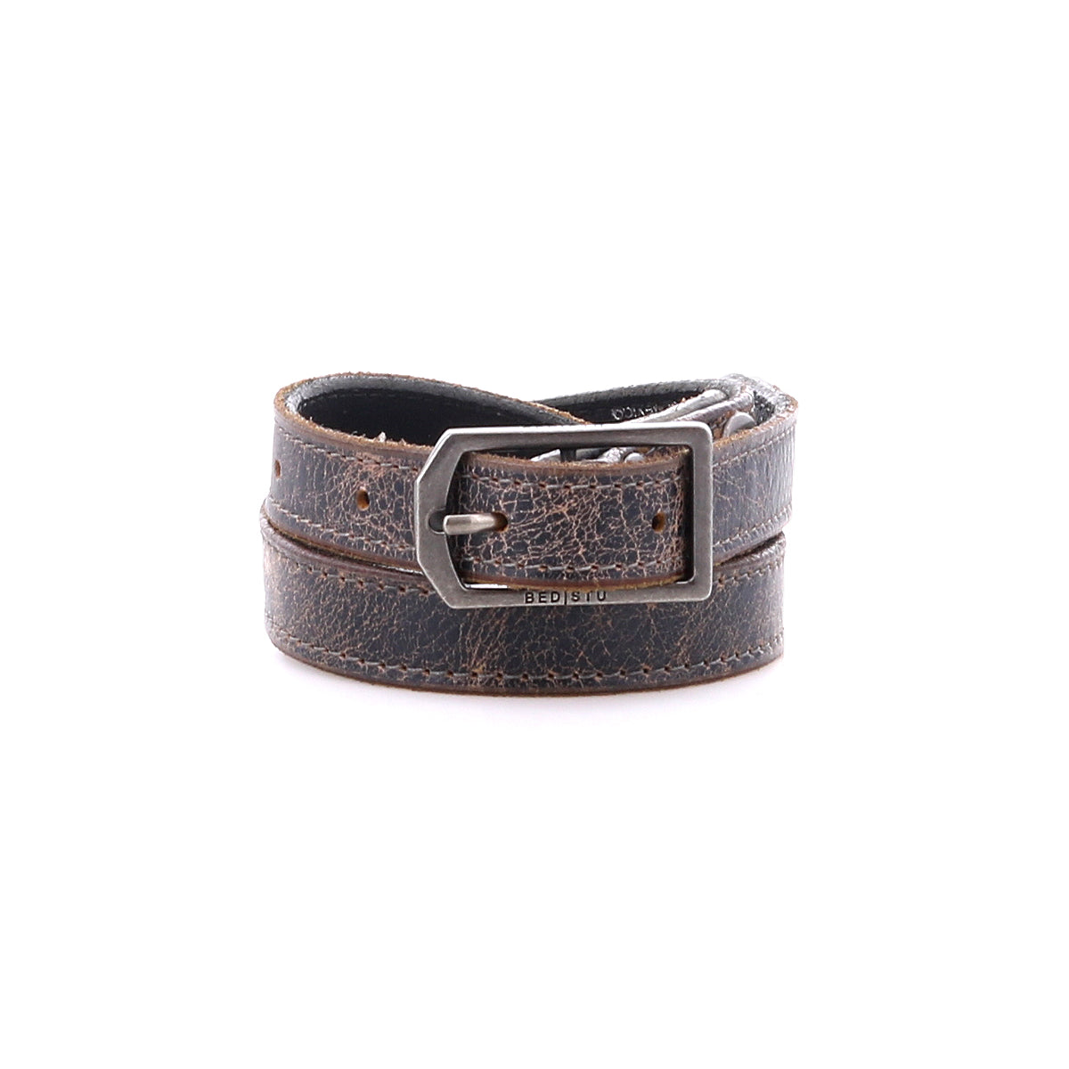 The Bed Stu Monae is a brown distressed leather skinny belt with a silver rectangular buckle, shown rolled up on a white background.