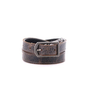 The Bed Stu Monae is a brown distressed leather skinny belt with a silver rectangular buckle, shown rolled up on a white background.